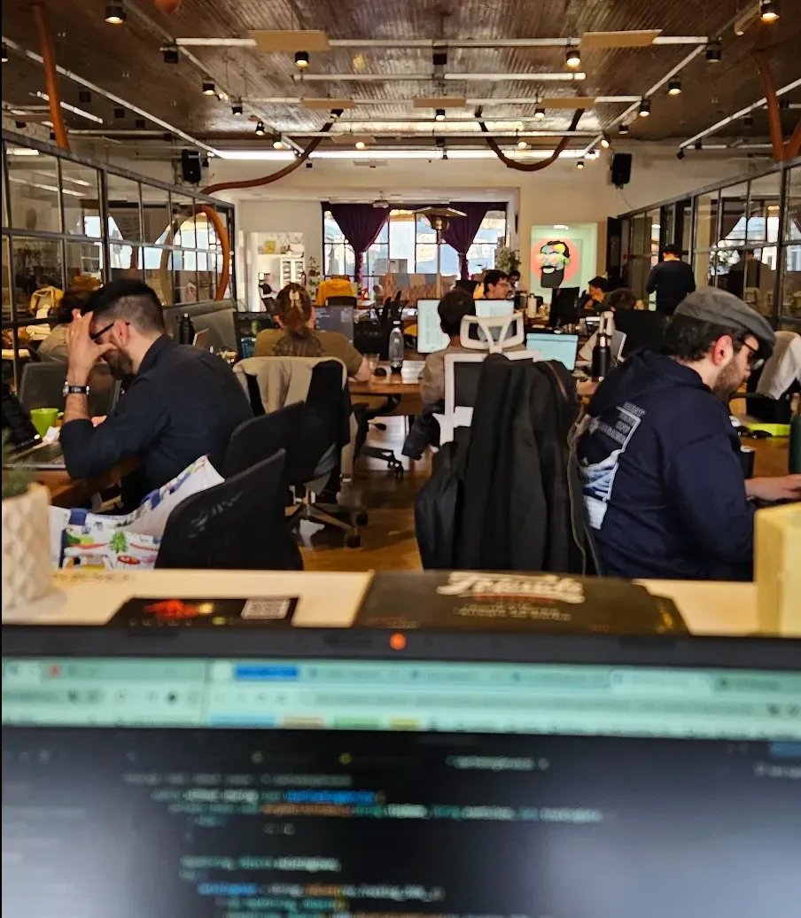 The Vantegrate team coding in a shared workspace